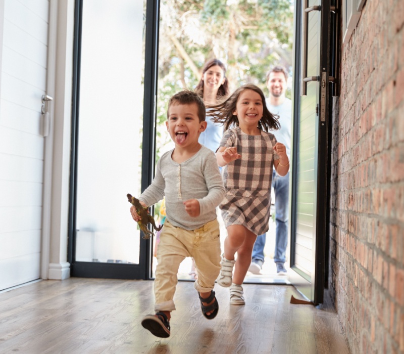 Children running through the front door.