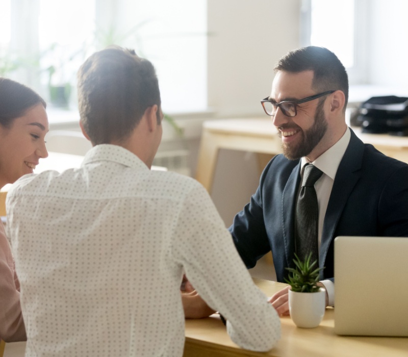 A young couple meeting with a financial planner.