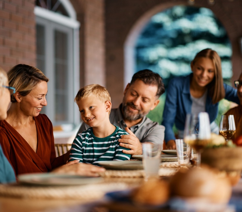 A multi-generational family eating dinner together