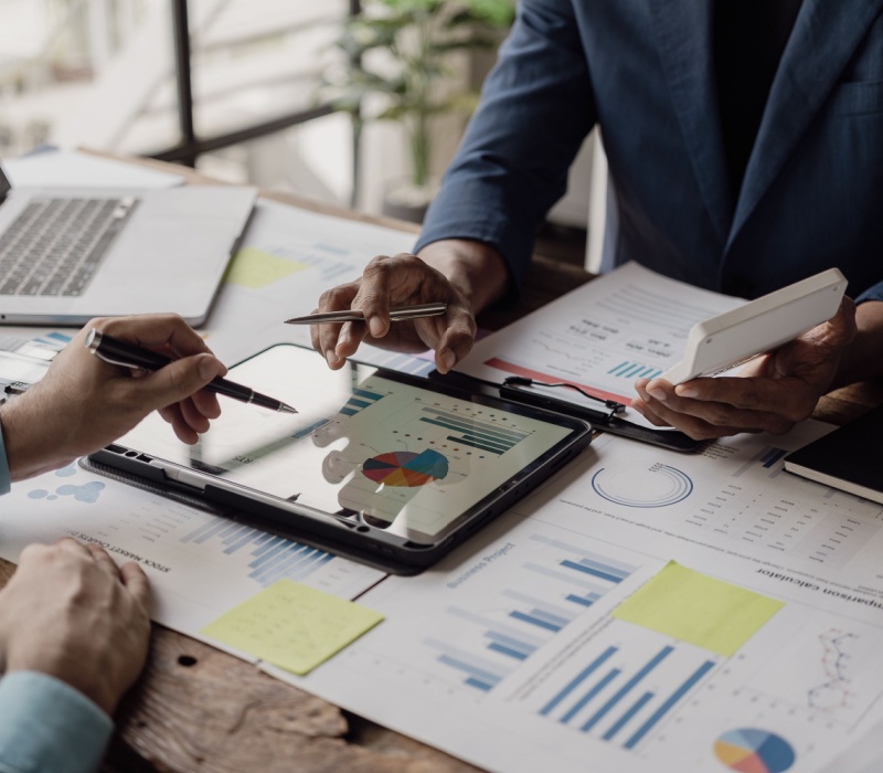 Business people looking at documents in an office.